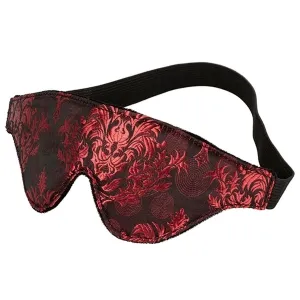 Schlafmaske mit rotem, floralem Muster und schwarzem Gummiband.