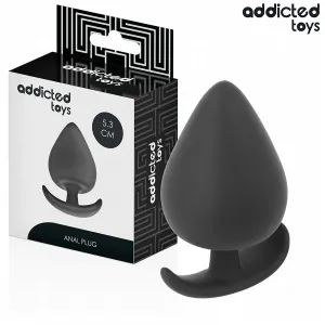 Schwarzer Analplug von Addicted Toys, 5,3 cm, neben der Verpackung.