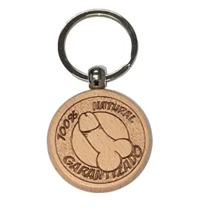 Round wooden key ring engraved with a stylized penis and the text 