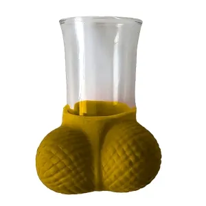 Glass with a yellow, textured base in the shape of two spheres.