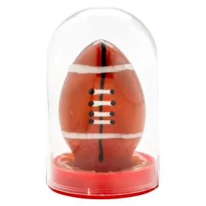 Candle in the shape of a football in a transparent plastic casing on a red base.