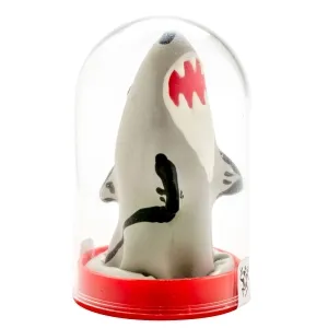 Grey shark with open mouth in a transparent dome on a red base.