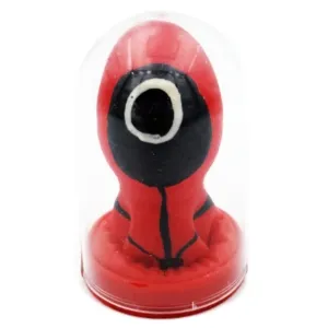 Red figure with a black face in a transparent dome, inspired by a TV series.