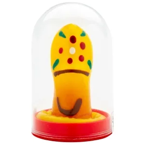 Yellow marzipan pastry in the shape of a mushroom with colorful dots, under a transparent dome on a red base.