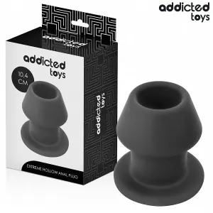 Schwarzer Analplug von Addicted Toys, 10,4 cm, neben der Verpackung mit geometrischem Muster.