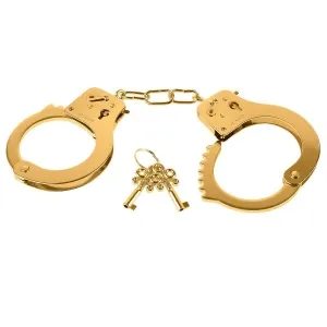 Golden handcuffs with two keys on a white background.