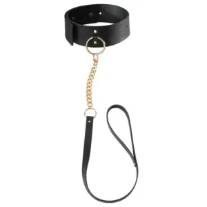 Black collar with gold chain and black leash, BDSM accessory.