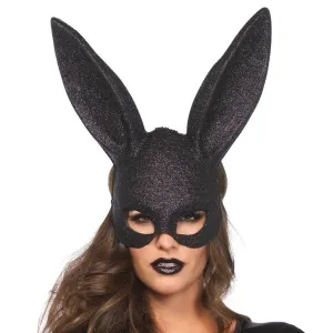 A person wearing a black rabbit mask and dark lipstick looks directly into the camera.